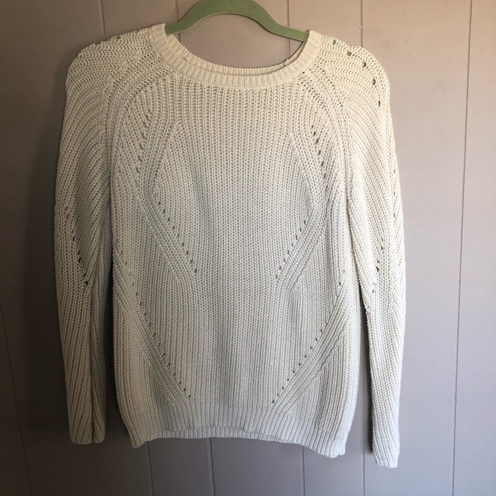 cream sweater with cutouts